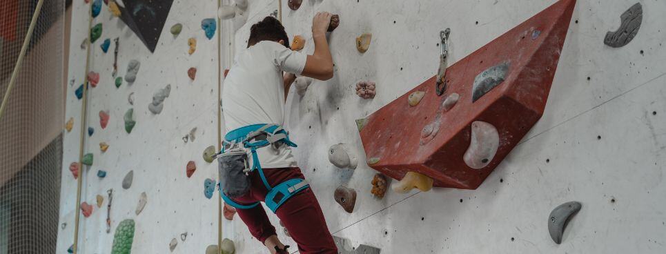 Indoor rock climbing student