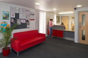 student at reception desk