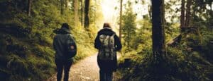 Two-People-Walking-in-the-Forest